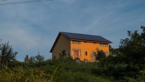 A house with a solar panel on the roof